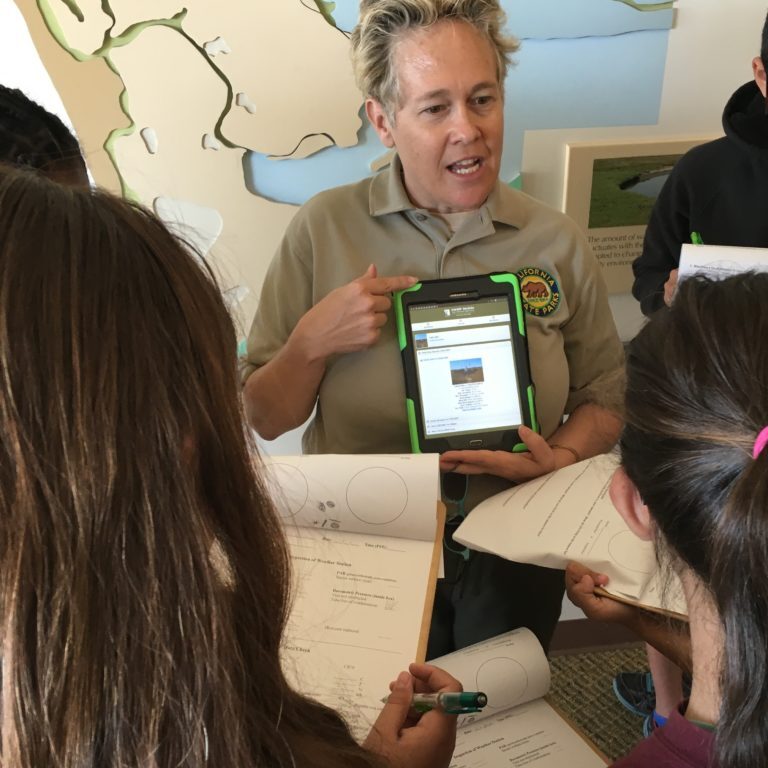 A California State Parks employee leads a program for students at the Tijuana Estuary Visitor Center