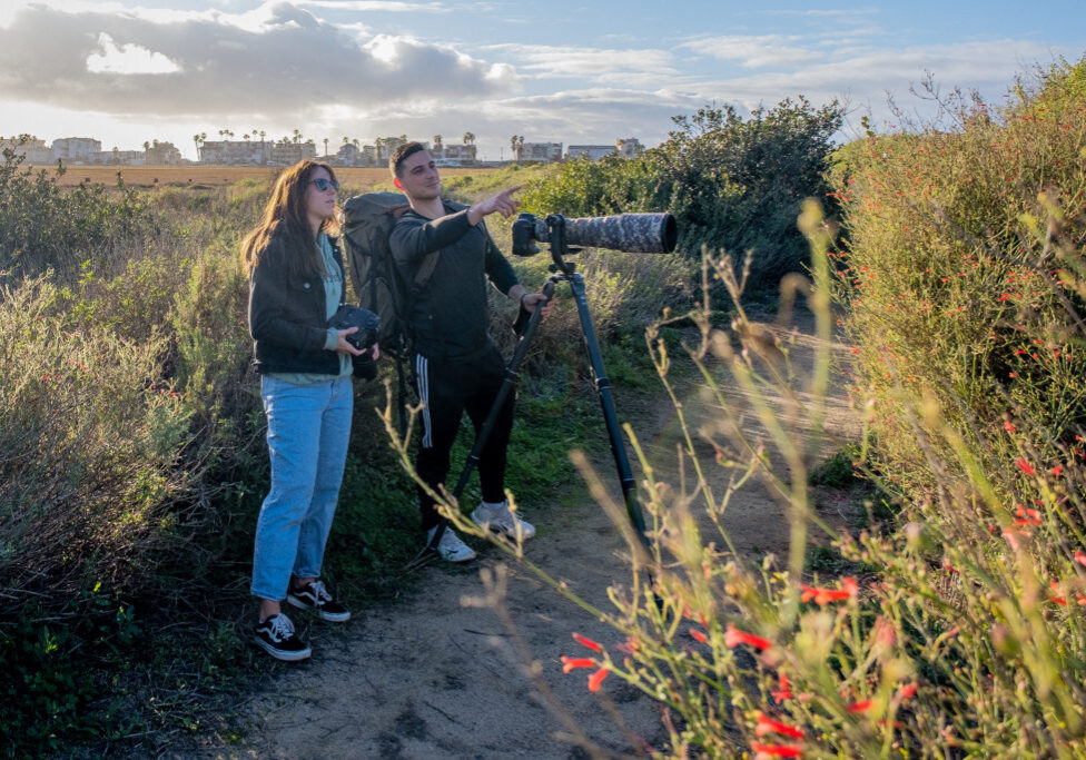 Nature photographers discuss the best approach to photograph hummingbirds near the Tijuana Estuary Visitor Center in Imperial Beach, CA.