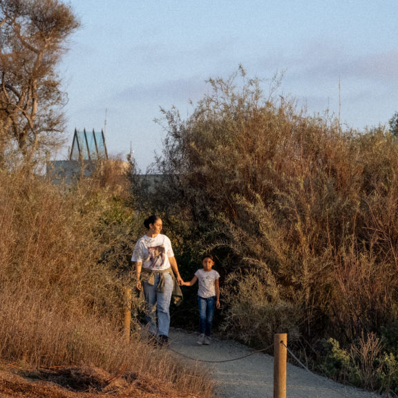 Mother and daughter explore a trail in the Tijuana River Estuary Reserve.